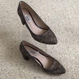 Clarks black & white hair calf pump with 2” patent leather heel.